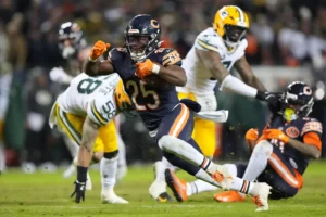 Chicago Bears' Kyle Monangai runs during the second half of an NFL wild-card playoff football game against the Green Bay Packers Saturday, Jan. 10, 2026, in Chicago. (AP Photo/Nam Huh)