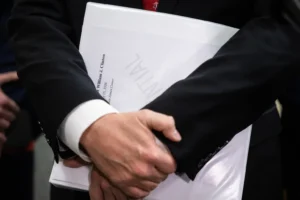 House Oversight Committee Chair James Comer (R-Ky.) holds a binder as he speaks with reporters after former President Bill Clinton did not appear for a deposition on Capitol Hill Jan. 13, 2026. (Francis Chung/POLITICO via AP Images)