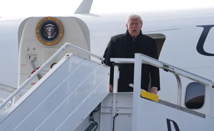 President Donald Trump steps off Air Force One after arriving at Zurich International Airport for the World Economic Forum, Wednesday, Jan. 21, 2026, in Zurich, Switzerland. (AP Photo/Evan Vucci)