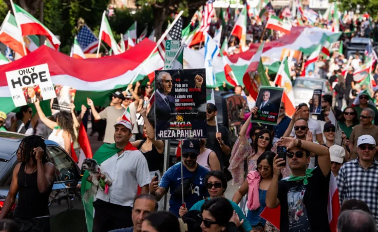 A large crowd of demonstrators gather near the Federal Building in the Westwood area to celebrate and call for freedom for the Iranian people in the wake of U.S.-Israel attacks on Iran that killed Iran's Supreme Leader Ayatollah Ali Khamenei on March 1, 2026 in Los Angeles, California. (Photo by Qian Weizhong/VCG via AP )
