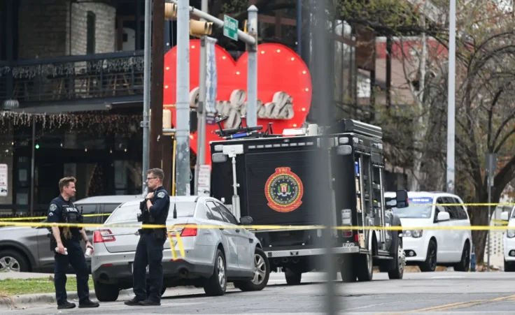 The Austin Police Department and the FBI investigate a shooting at Buford's on 6th Street on Sunday, March 1, 2026, in Austin, Texas. (AP Photo/Jack Myer)