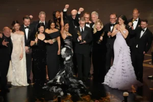 Jose Antonio Garcia, from left, Florencia Martin, Leonardo DiCaprio, Cassandra Kulukundis, Regina Hall, Shayna McHale, Teyana Taylor, Michael Bauman, Paul Thomas Anderson, Anthony Carlino, Will Weike, Sara Murphy, Chase Infiniti, Christopher Scarabosio, and Andy Jurgensen accept the award for best picture award for "One Battle After Another" during the Oscars on Sunday, March 15, 2026, at the Dolby Theatre in Los Angeles. (AP Photo/Chris Pizzello)