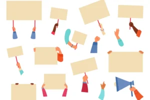 Hands holding placards and blank protest signs. By MicroOne/adobe.stock.com.