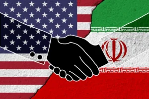 Conceptual image of US and Iranian leaders shaking hands. By SunshineSeeds/stock.adobe.com. Cease fire, Trump