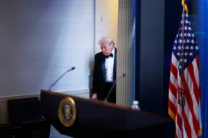 President Donald Trump arrives at the James Brady Press Briefing Room at the White House after a shooting incident outside the ballroom at the annual White House Correspondents' Association Dinner in Washington, Saturday, April 25, 2026. (AP Photo/Tom Brenner)