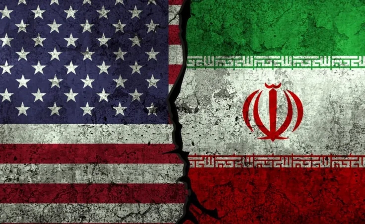 USA vs Iran political clashes and conflict representation with flags painted on grunge textured wall backdrop By visuals6x/stock.adobe.com