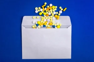 Pills in an envelope. By Sabphoto/stock.adobe.com. abortion pill