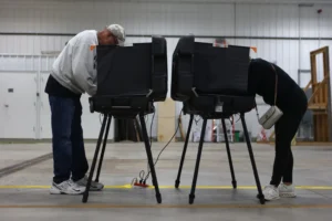 Donna Wooten, right, votes across from her husband, Jerry Wooten in a vote center during a primary election on Tuesday, May 5, 2026, in West Lafayette, Ind. (AP Photo/Cara Penquite) Trump