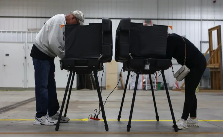 Donna Wooten, right, votes across from her husband, Jerry Wooten in a vote center during a primary election on Tuesday, May 5, 2026, in West Lafayette, Ind. (AP Photo/Cara Penquite) Trump