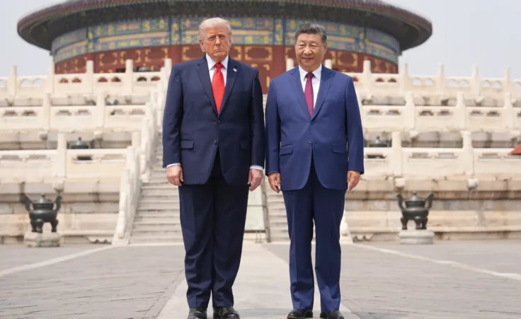 President Donald Trump, left, stands with Chinese President Xi Jinping at the Temple of Heaven on Thursday May 14, 2026, in Beijing. (AP Photo/Mark Schiefelbein)