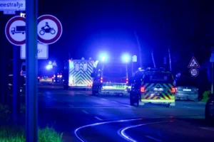 A convoy of police and fire trucks carrying an American Ebola patient from the Congo arrives at the Charite Campus Virchow Klinikum. Photo by: Christophe Gateau/picture-alliance/dpa/AP Images