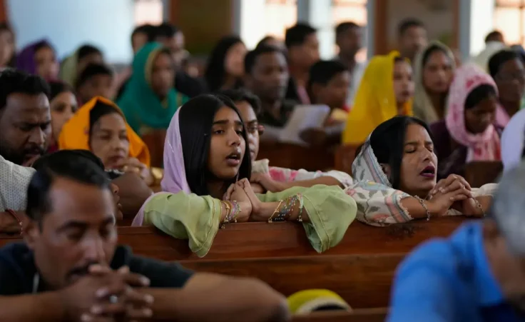 Indian Christian devotees offer prayers at a church on Easter Sunday in Jammu, India, Sunday, April 5, 2026.(AP Photo/Channi Anand)