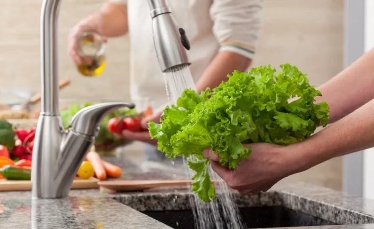 Washing vegetables for a salad By Photographee.eu/stock.adobe.com