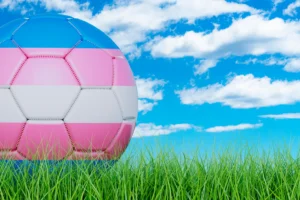Transgender flag on a soccer ball. By alexlmx/stock.adobe.com. Supreme Court rules on transgender athletes in girls’ sports.