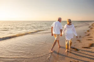 Happy older couple walking on the beach holding hands. By DarrenBaker/stock.adobe.com. A perceptive article about finding purpose that matters most