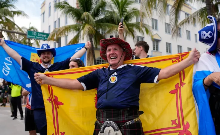 Scotland fans with the Tartan Army gather on Ocean Drive on the eve of the Group C World Cup game between Scotland and Brazil, in Miami Beach, Fla., Tuesday, June 23, 2026. (AP Photo/Rebecca Blackwell)
